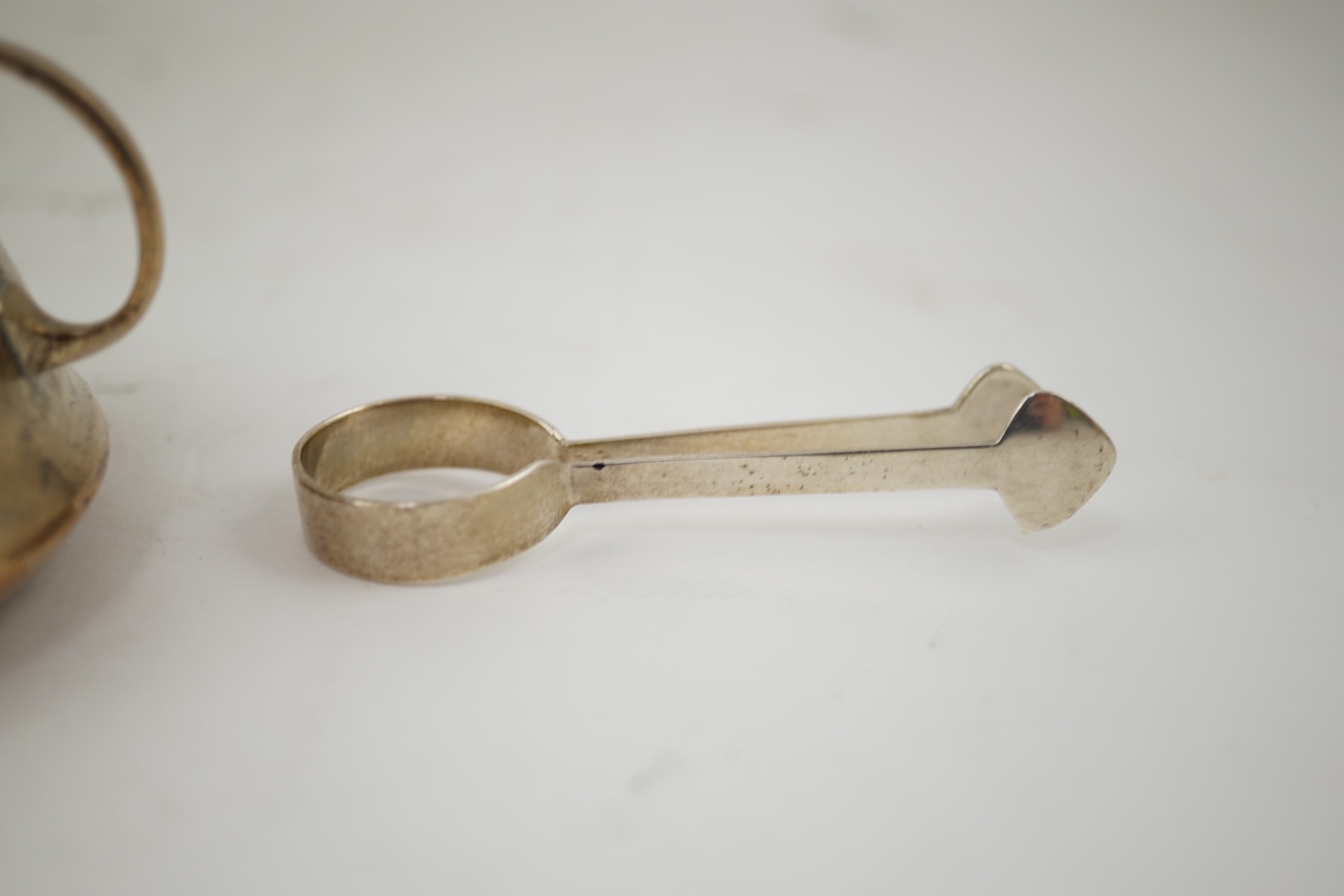 An Edwardian silver bachelor's two handled sugar bowl and matching sugar tongs, by Liberty & Co